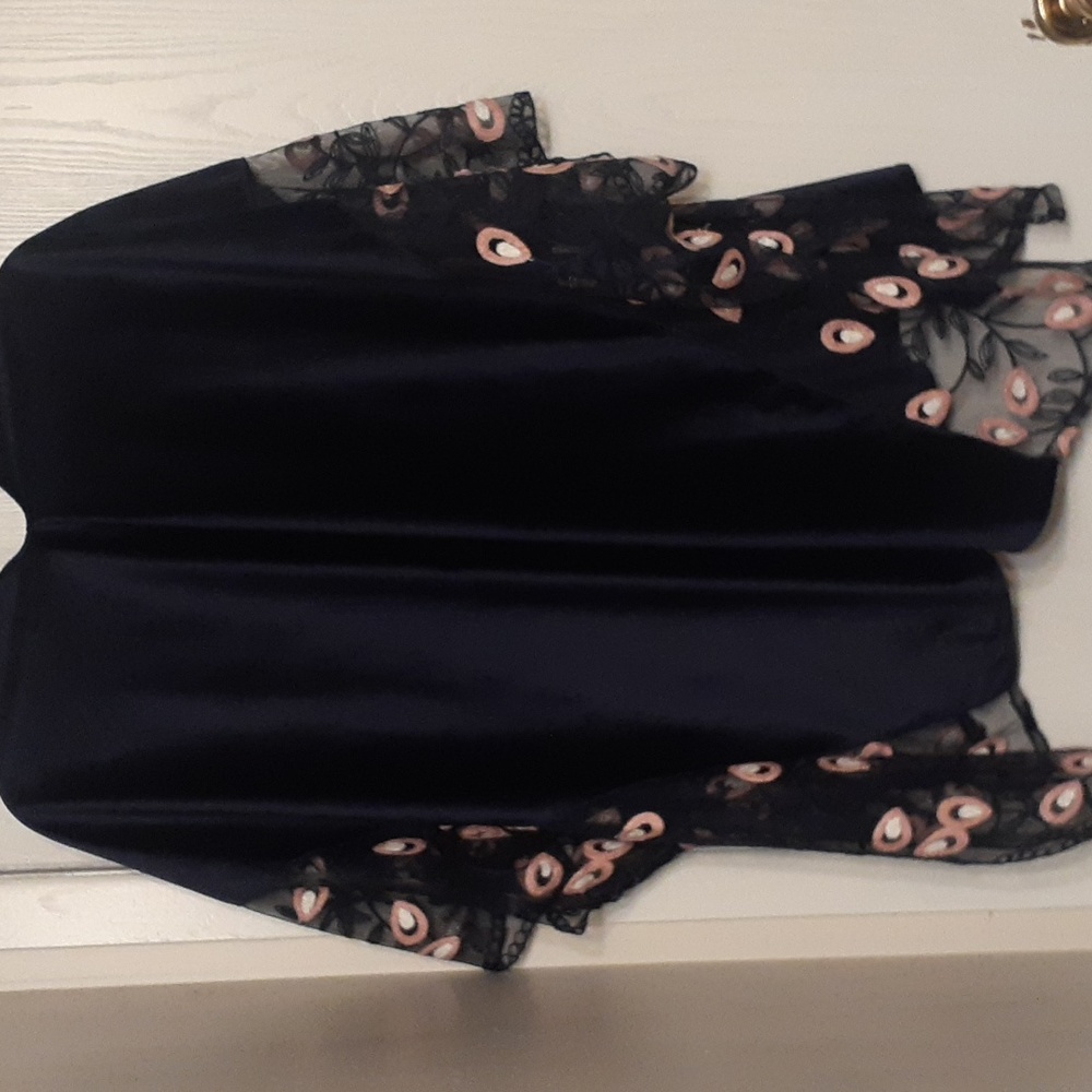 stunning velvet soft navy caftan with floral trim.